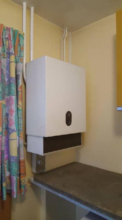 Wall-mounted white boiler
